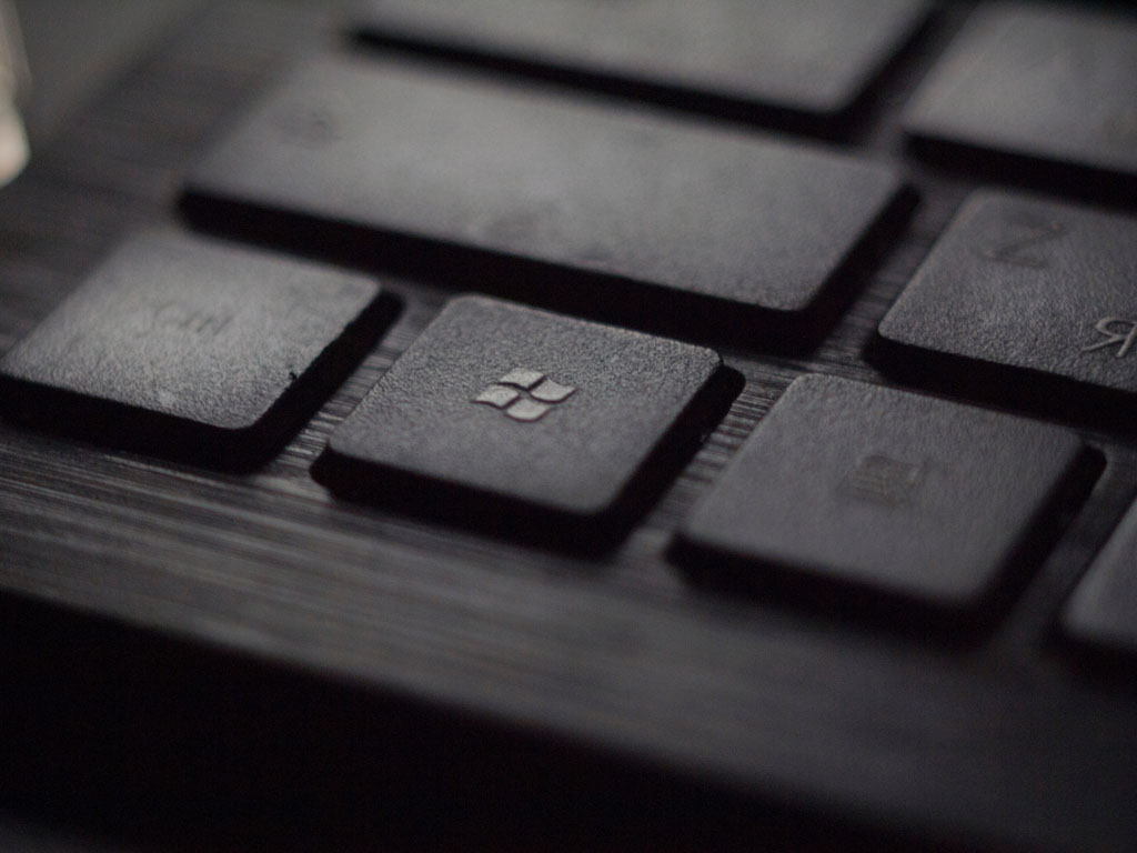 black laptop computer keyboard Windows logo